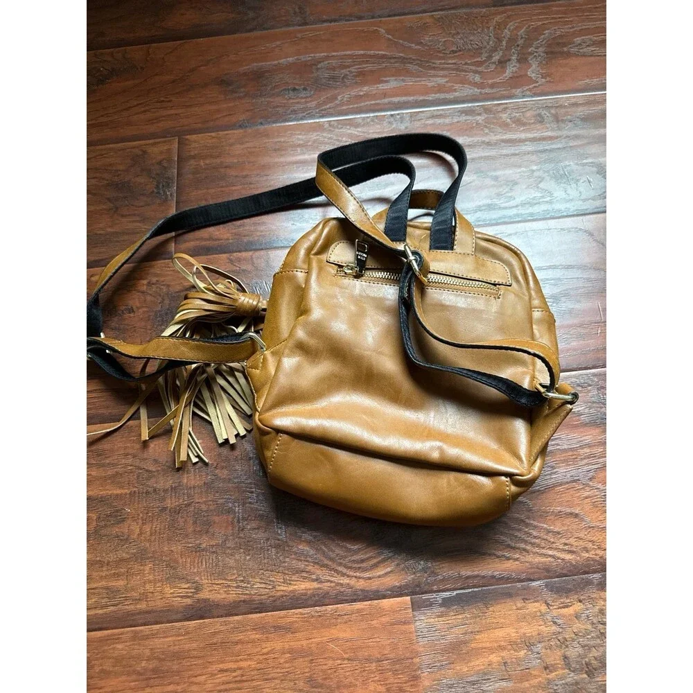 Steve Madden camel-colored Tampa backpack featuring a tassel detail